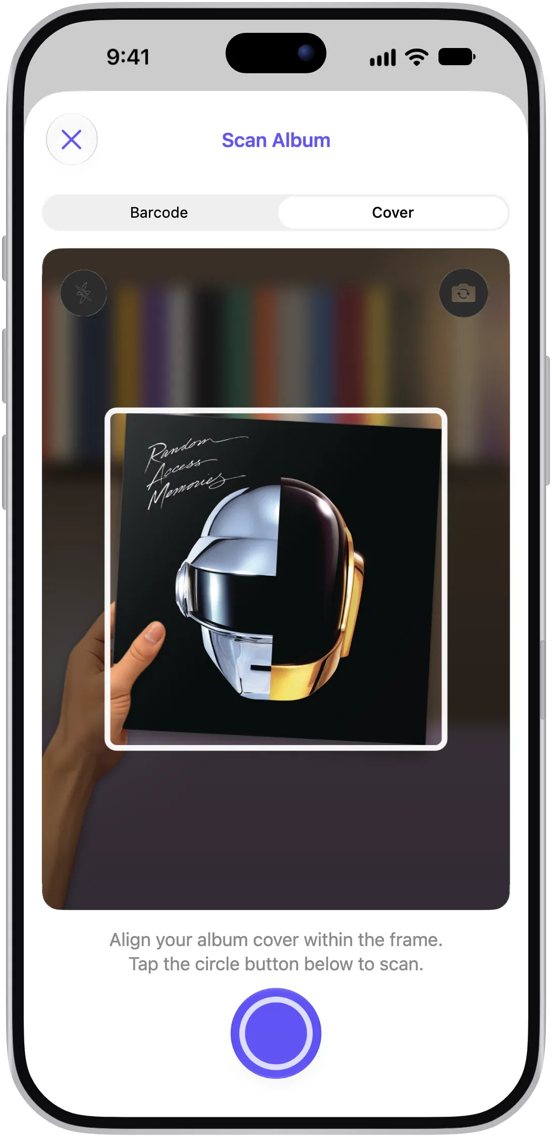 VinylBox Scan Album sheet on iPhone in Cover mode, with a hand holding the sleeve of Daft Punk’s Random Access Memories inside the camera frame